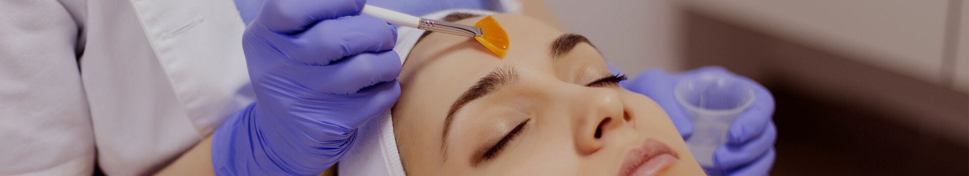 woman receiving facial