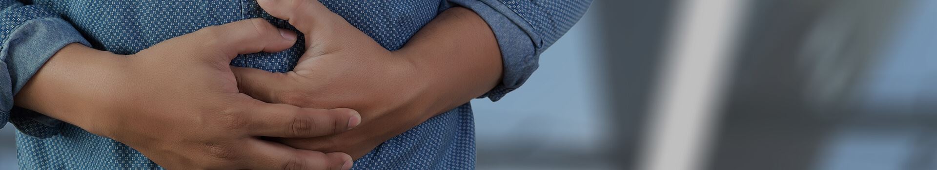 hands holding abdomen