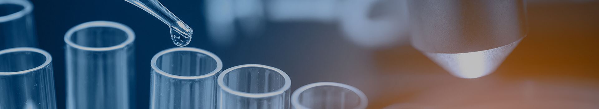 liquid being dropped into test tube